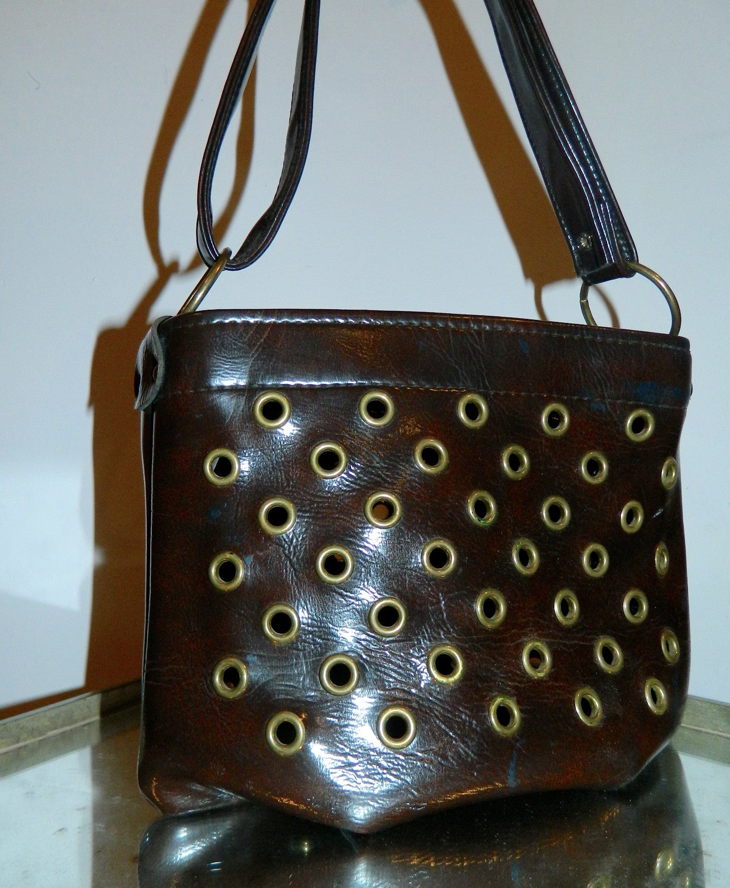 MOD handbag vintage 1960s brown vinyl grommeted purse / brass O rings